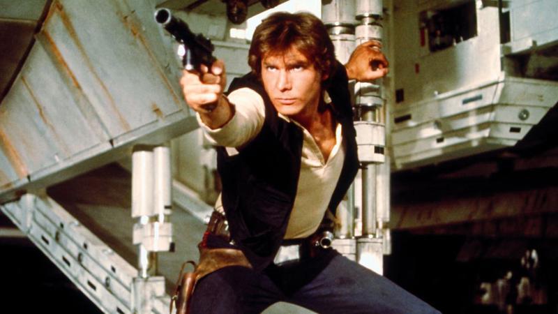 Han Solo holding a blaster in Star Wars: A New Hope.