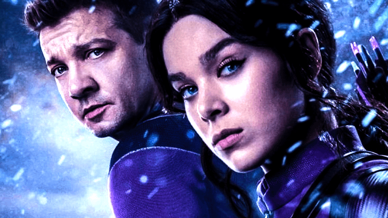 Jeremy Renner as Clint Barton and Hailee Steinfeld as Kate Bishop standing together in the snow in Hawkeye.