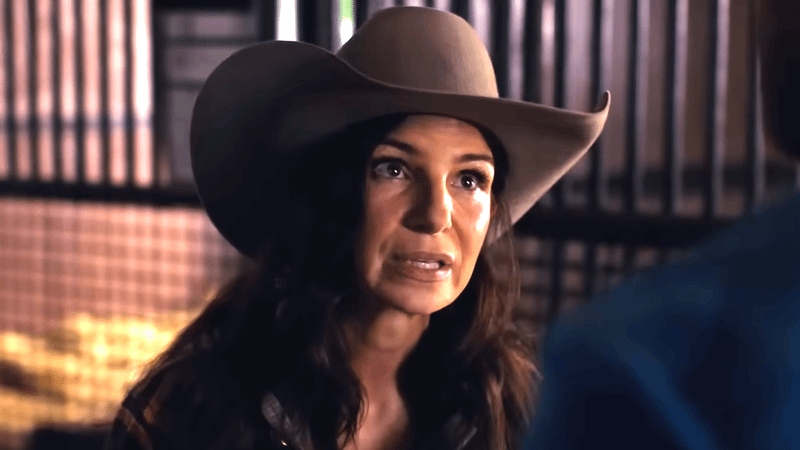 A woman wearing a cowboy hat in Heartland Season 19.