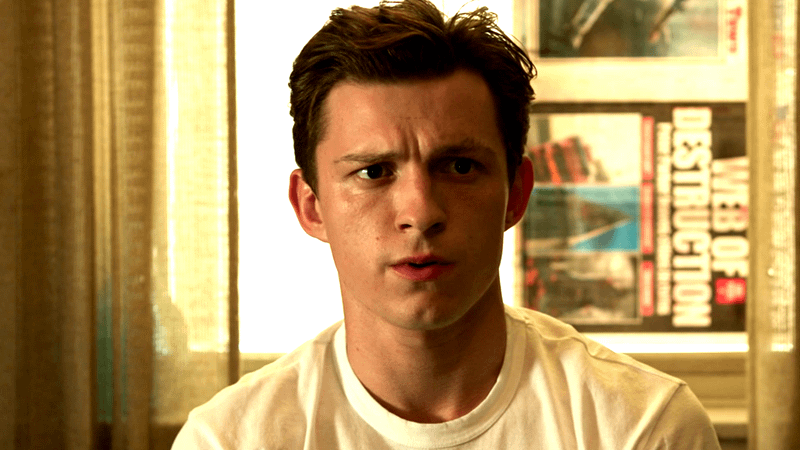Tom Holland as Peter Parker looking concerned in a sun-lit room in Spider-Man: No Way Home