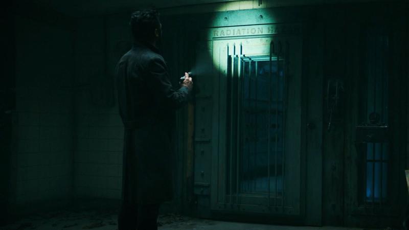 Butcher looking at a radiation sign in The Boys.