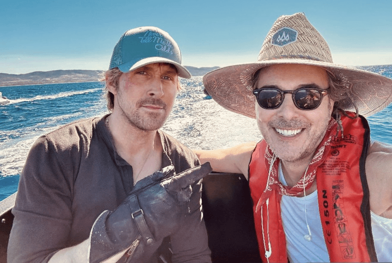 Ryan Gosling and Shawn Levy on a boat behind the scenes of Star Wars: Starfighter