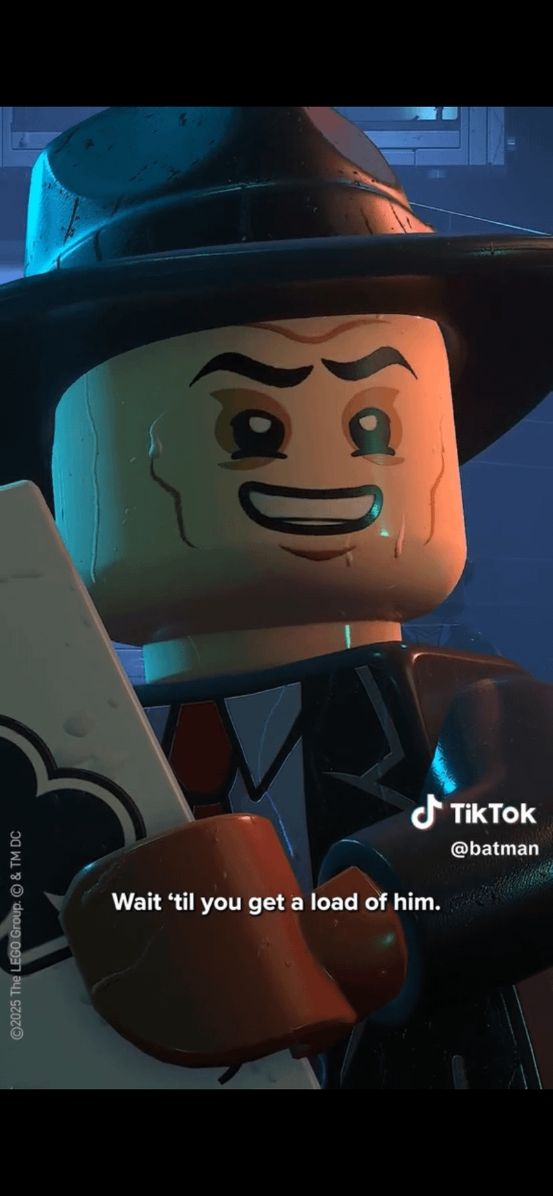 Jack Napier standing in the rain in his top hat and suit in LEGO Batman: Legacy of the Dark Knight