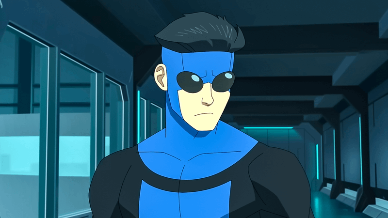 Mark Grayson wearing blue and black suit in 'Invincible.'