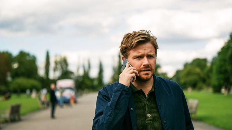 Jack Lowden on phone in Slow Horses.