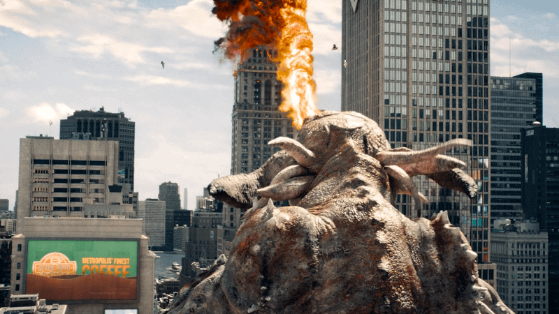 Kaiju shooting fire at Superman in Superman