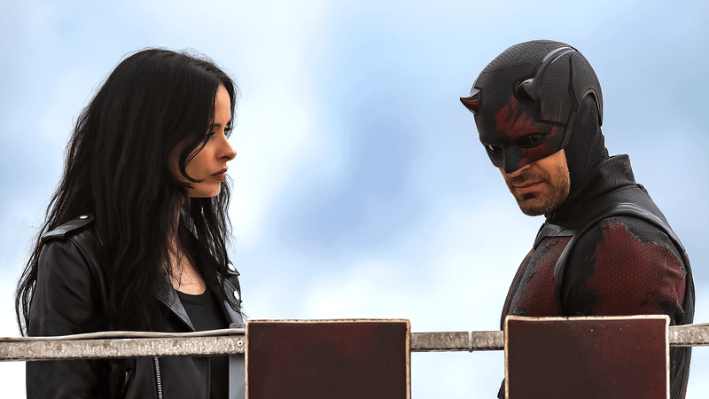 Krysten Ritter as Jessica Jones & Charlie Cox as Daredevil in Daredevil: Born Again Season 2.