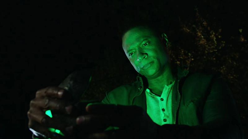 John Diggle holding a glowing green box in Arrow.