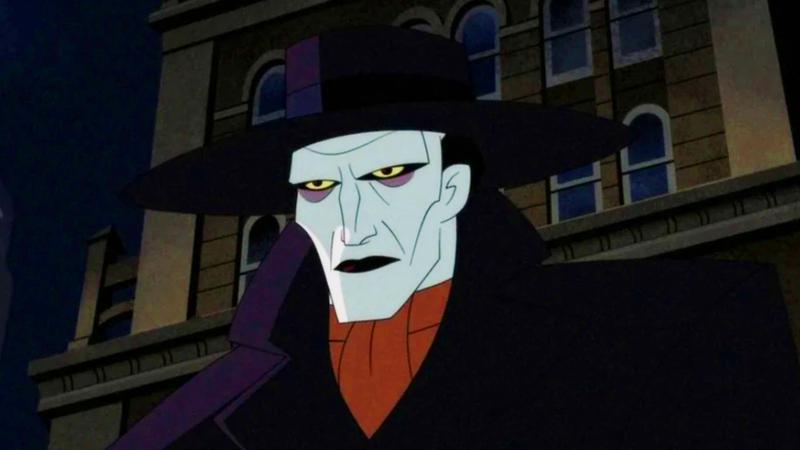 Joker sports a fedora and pale white skin.