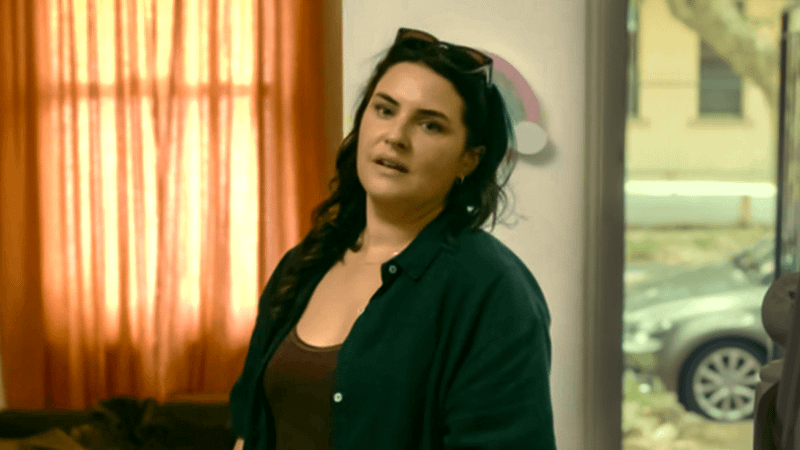 Morgana O'Reilly as Joni standing in a doorway in Playing Gracie Darling