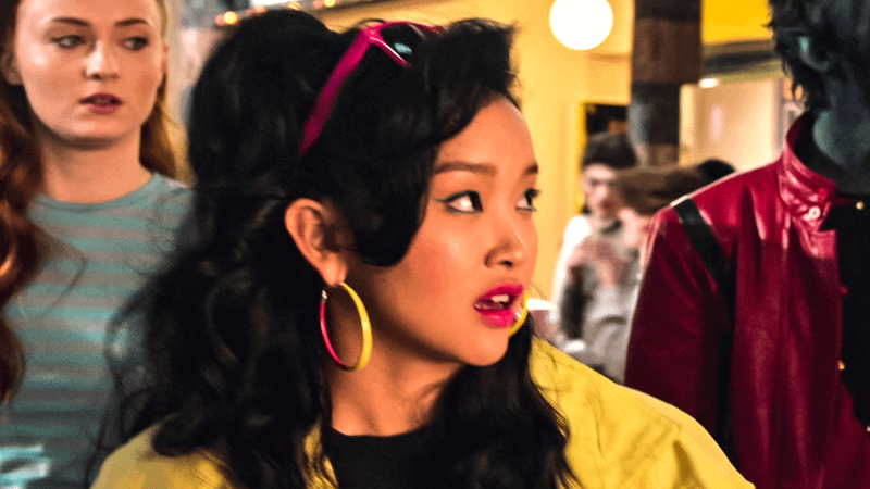 Lana Condor as Jubilee looking off to the side.