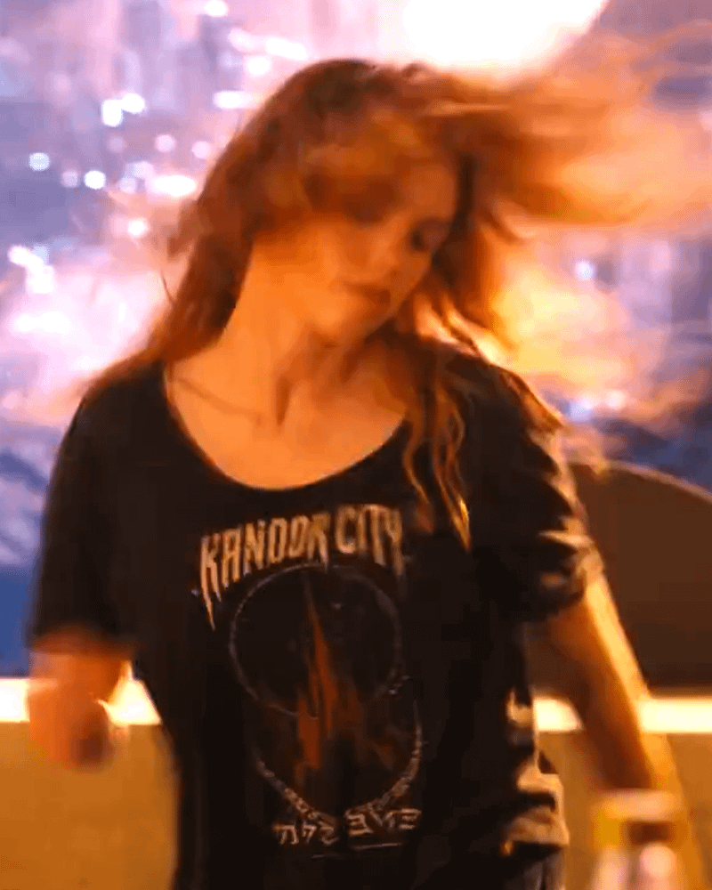Milly Alcok wearing Kandor City shirt in Ulta Beauty promo.