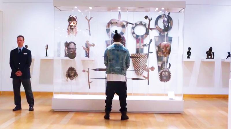 Michael B. Jordan as Killmonger standing in a museum in Black Panther