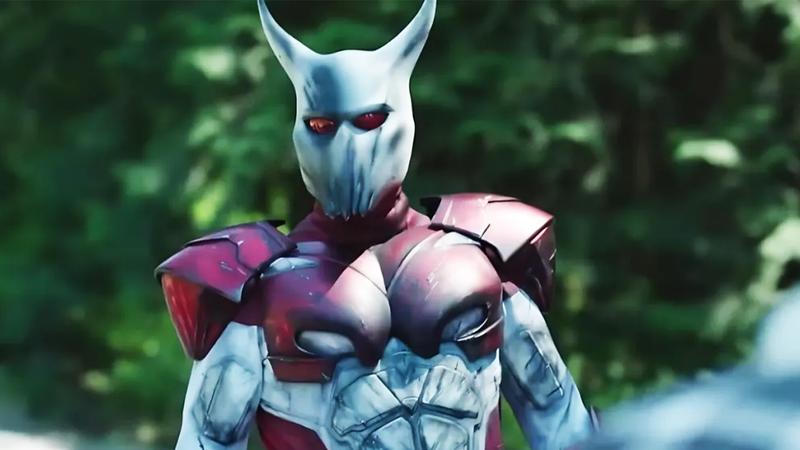 White Dragon in his red and white costume in Peacemaker.