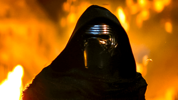 Kylo Ren standing in front of fire.