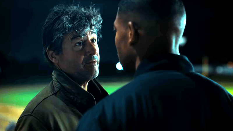 Kyle Chandler as Hal Jordan talking to Aaron Pierre as John Stewart in 'Lanterns' trailer.