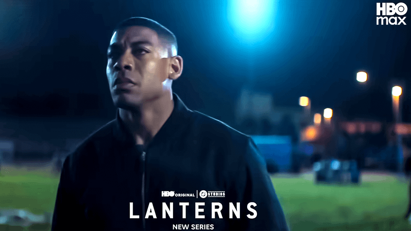 Aaron Pierre as John Stewart standing in a field at night in Lanterns.