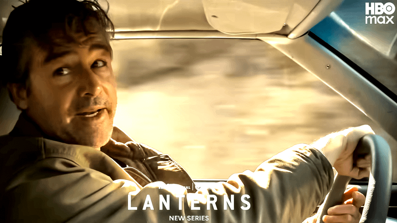 Kyle Chandler as Hal Jordan driving a car down a dusty highway in Lanterns.