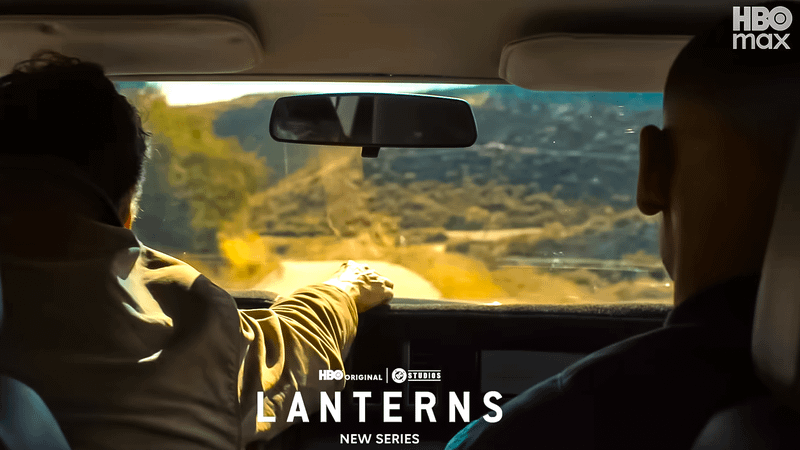 Kyle Chandler as Hal Jordan putting his Green Lantern ring on a car dashboard