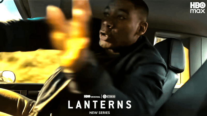 Aaron Pierre as John Stewart reaching to his side in a car in Lanterns.