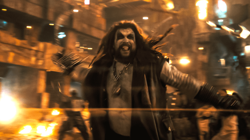 Jason Momoa as Lobo wielding a chain in 'Supergirl.'