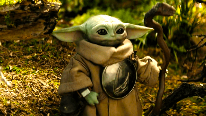 Grogu with stick in The Mandalorian and Grogu.
