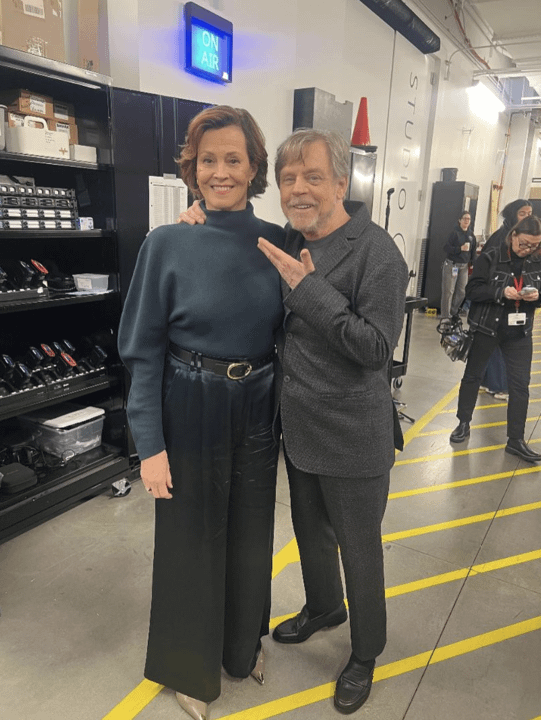 Sigourney Weaver and Mark Hamill smiling for a photo.