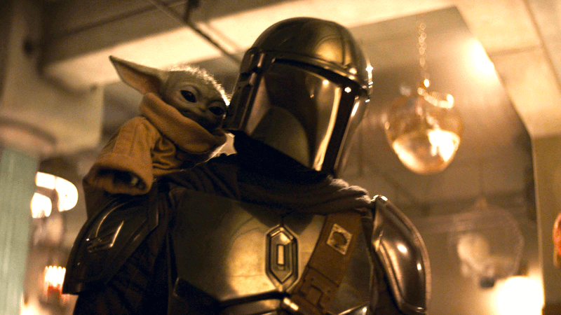 Din Djarin with Grogu on his shoulder in The Mandalorian & Grogu