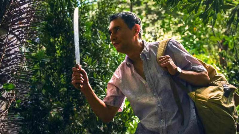 Carlos Manuel Vesga as Manousos with chunga palm in Pluribus Episode 7