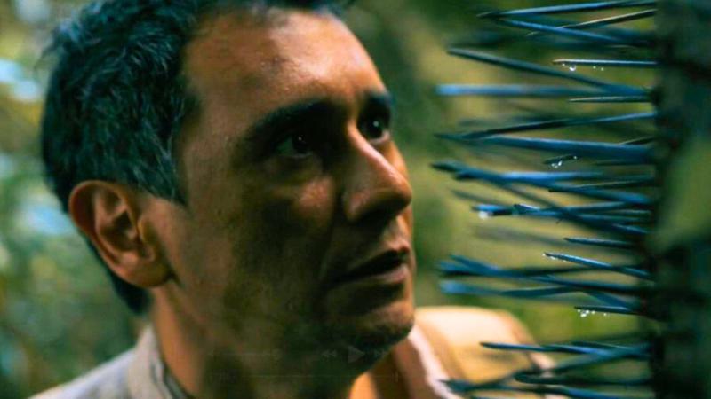 Carlos Manuel Vesga as Manousos with chunga palm in Pluribus Episode 7