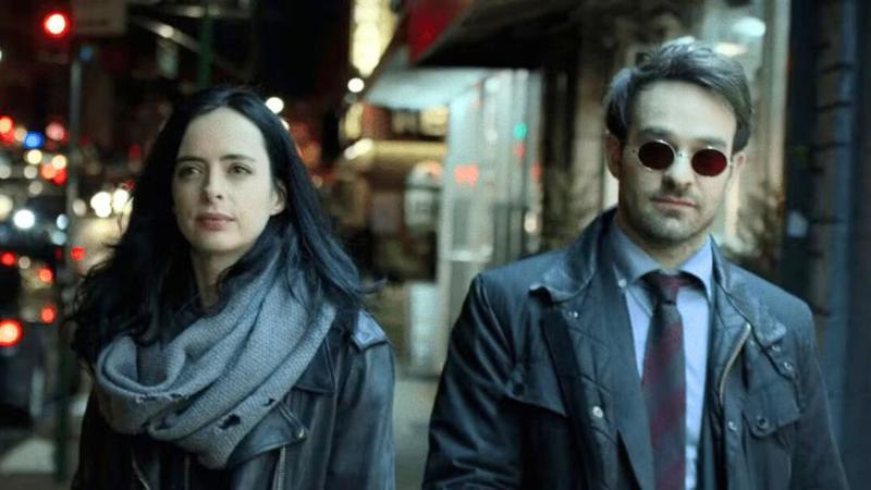 Krysten Ritter as Jessica Jones and Charlie Cox as Matt Murdock