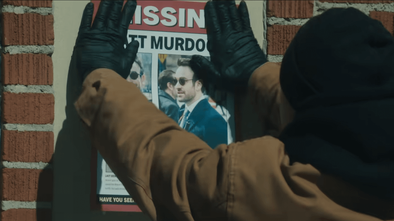 Someone hanging up a missing poster for Matt Murdock.