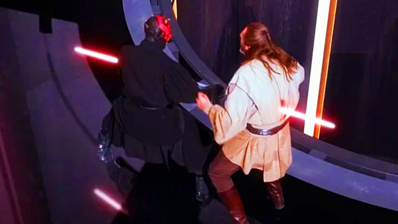 Darth Maul thrusting his lightsaber through Qui-Gon's midsection.