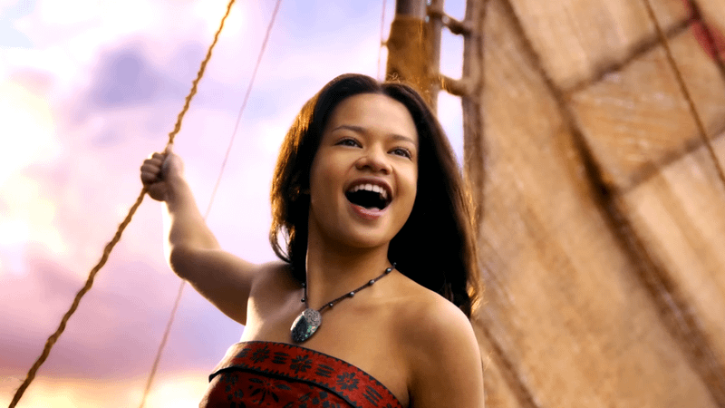 Catherine Laga'aia as Moana singing on a boat in Moana