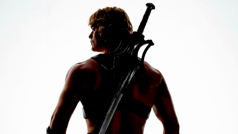 Nicholas Galintzine as He-Man with a sword on his back in Masters of the Universe