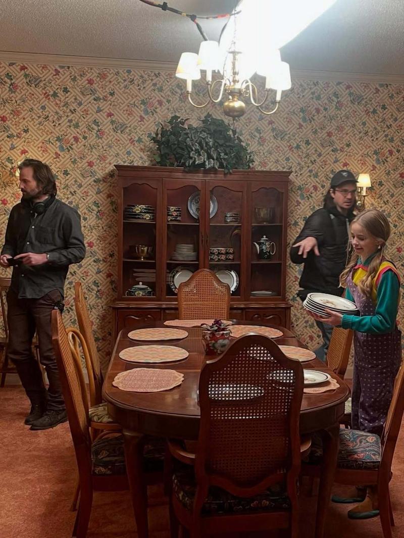 Nell Fisher setting a table in Stranger Things