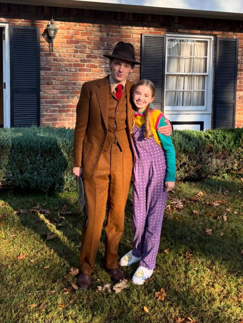 Jamie Campbell Bower and Nell Fisher in costume on the set of Stranger Things