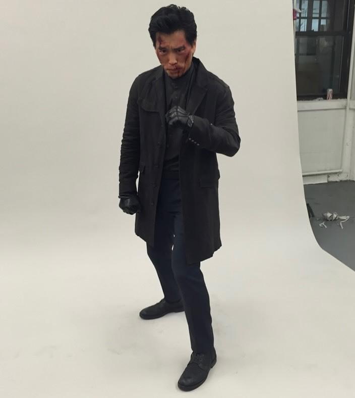Peter Shinkoda rocks black cloth, and leather gloves.