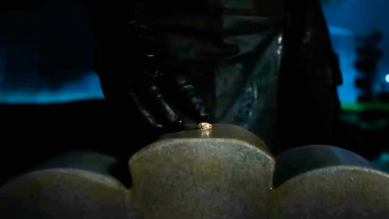 Ben Reilly places a ring on a grave in Spider-Noir.