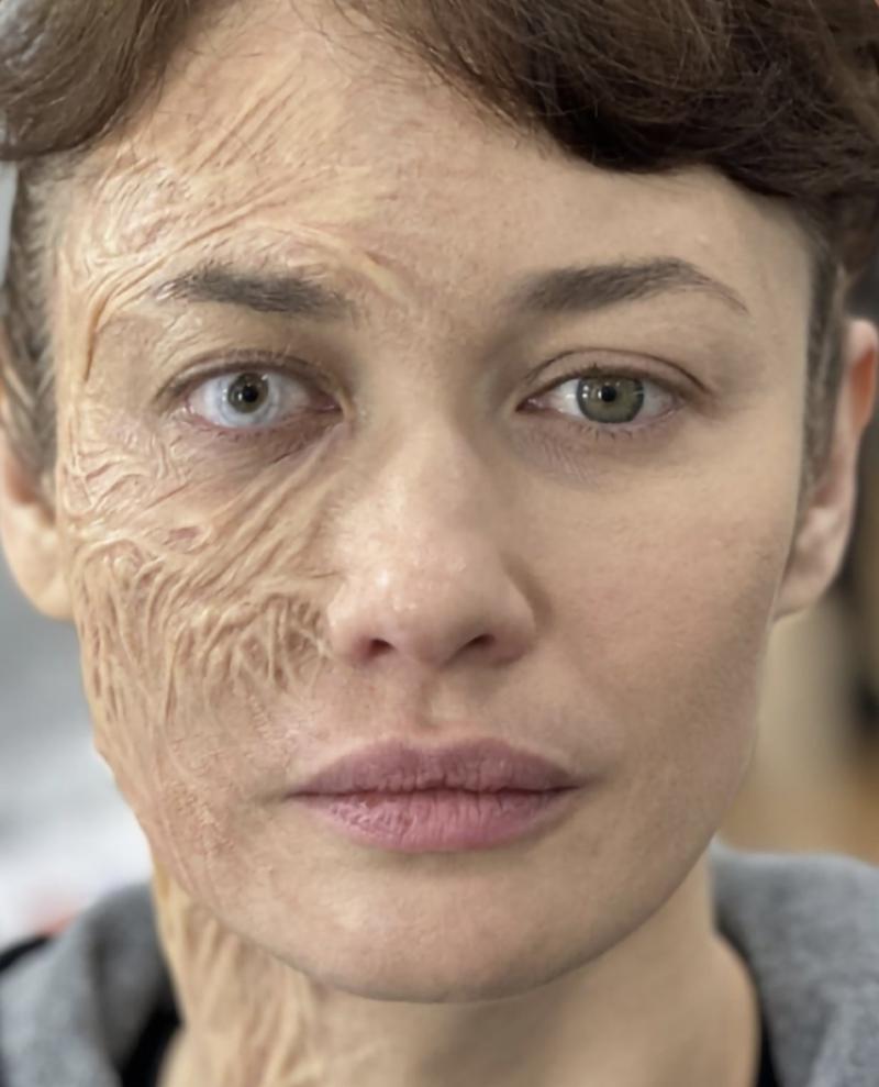Olga Kurylenko with Taskmaster make-up on