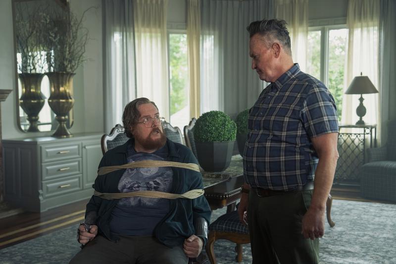 Steve Agee as John Economos, Robert Patrick as Auggie Smith in Peacemaker Season 2, Episode 7