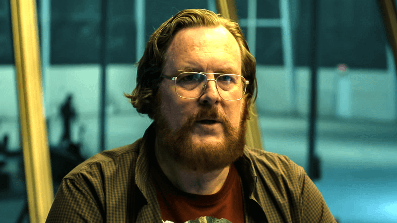 Steve Agee as John Economos in 'Peacemaker' Season 2.