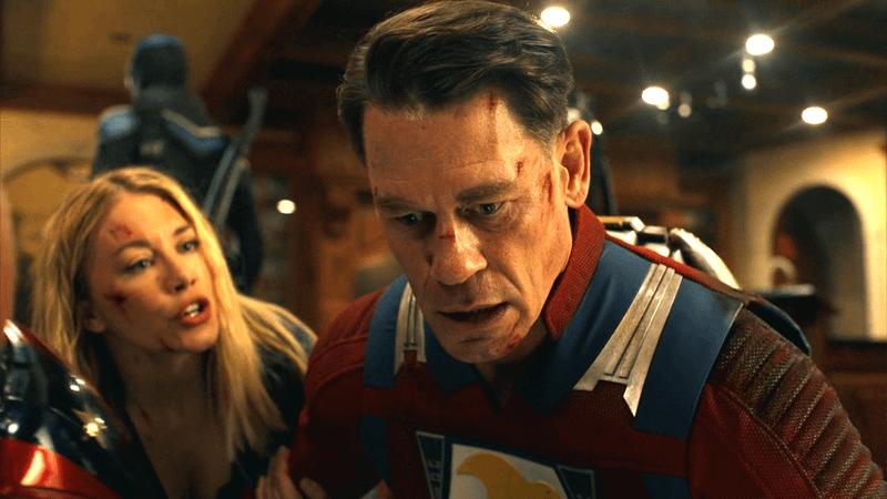 Jennifer Holland as Emilia Harcourt and John Cena as Peacemaker in Peacemaker Season 2