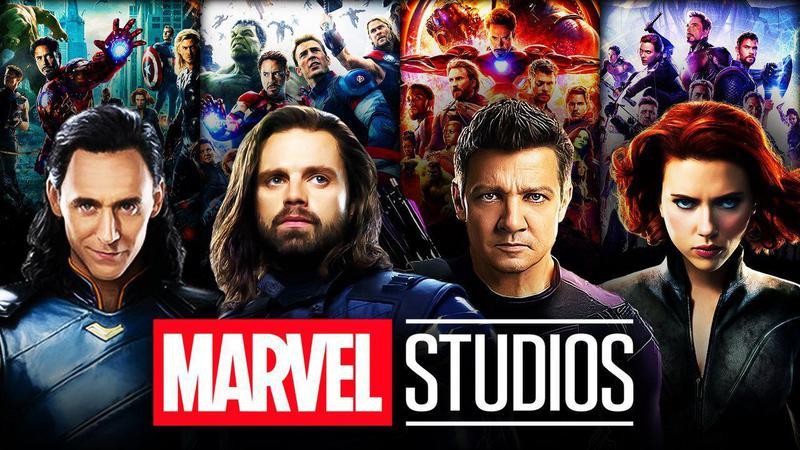 Various MCU stars and Avengers posters behind the Marvel Studios logo.