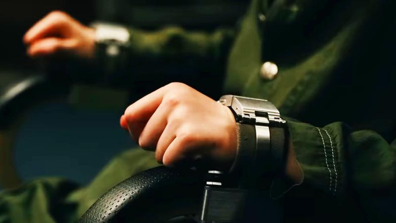 A woman handcuffed to a chair.