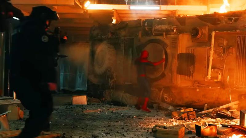 Spider-Man taking a panel off the tank.