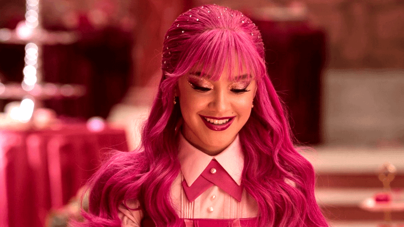 Pink smiling down at something she is holding in her hands.