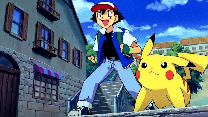 Ash and Pikachu standing on a city street in Pokémon 