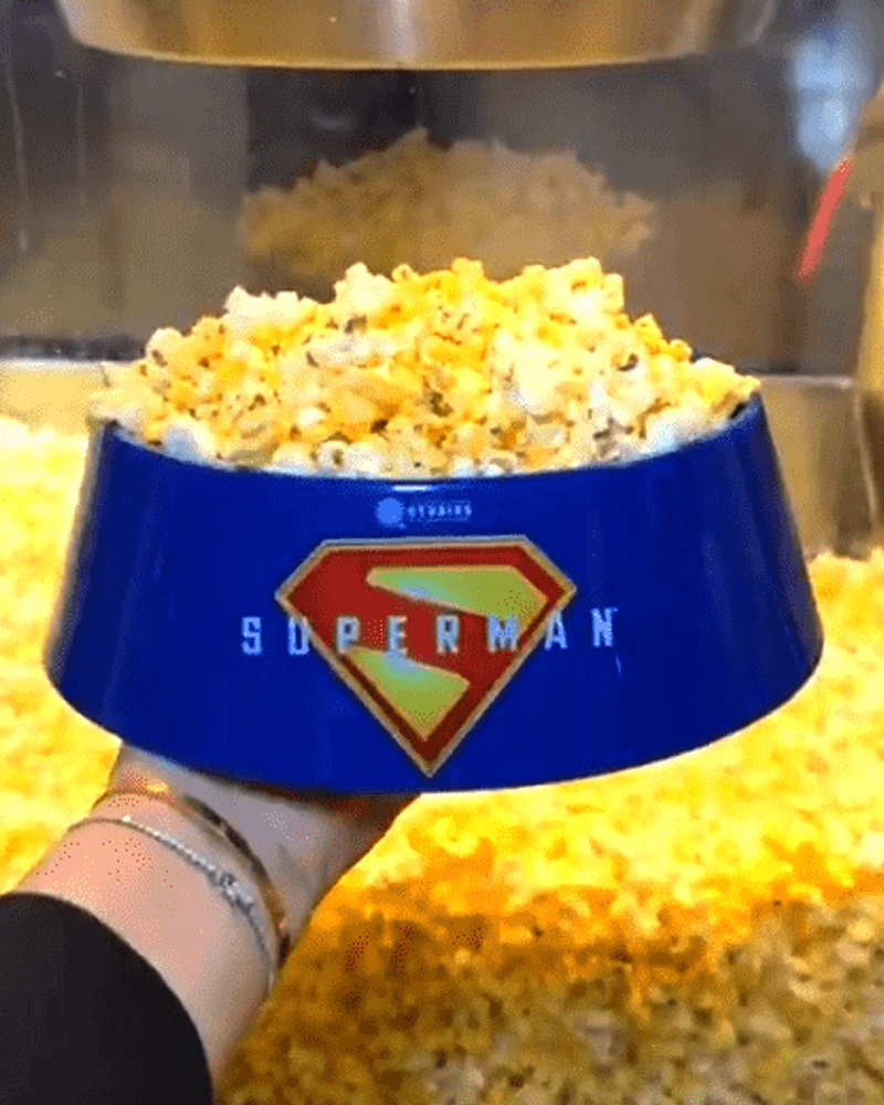 A dog bowl Superman popcorn bucket.