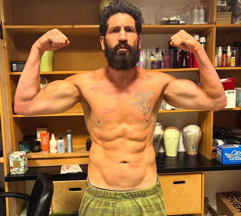 Jon Bernthal shirtless and flexing